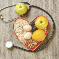 Heart-shaped bowl of healthy food with stethoscope